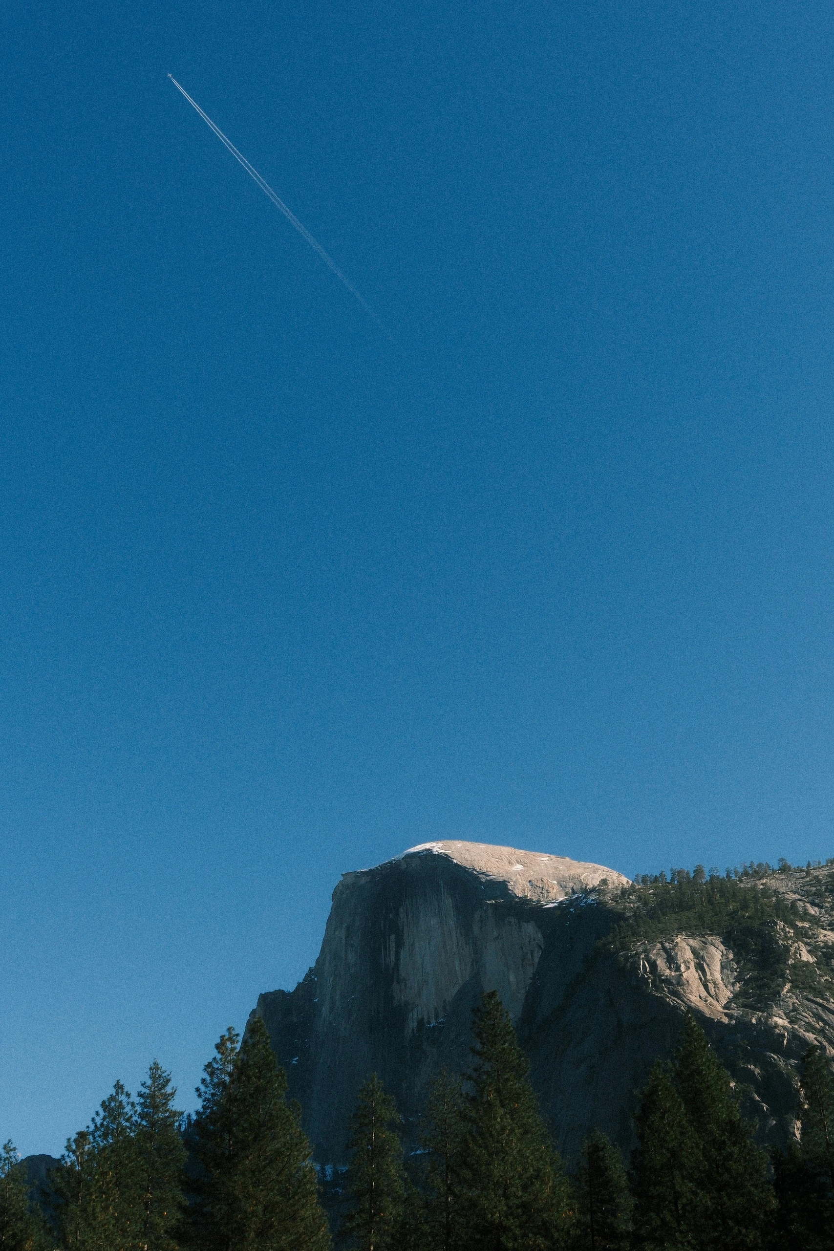 Half Dome and a Plane